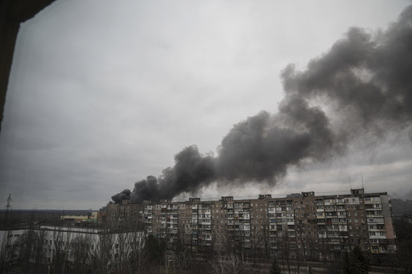 Smoke rises after shelling by Russian forces in Mariupol on Friday, 