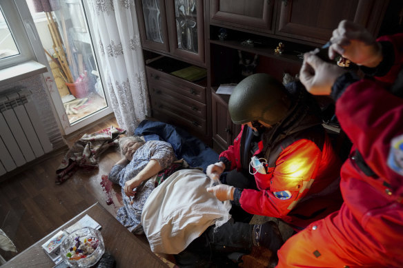 Ambulance paramedics treat an elderly woman wounded by shelling in Mariupol. She was later transferred to a maternity hospital that’s been converted into an emergency medical ward.