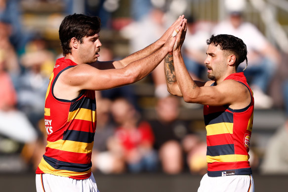 Darcy Fogarty (left), who kicked three goals, and Izak Rankine celebrate.