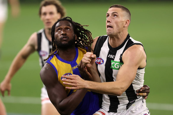 Darcy Cameron (right) battles Eagles ruckman Nic Naitanui on Saturday night.