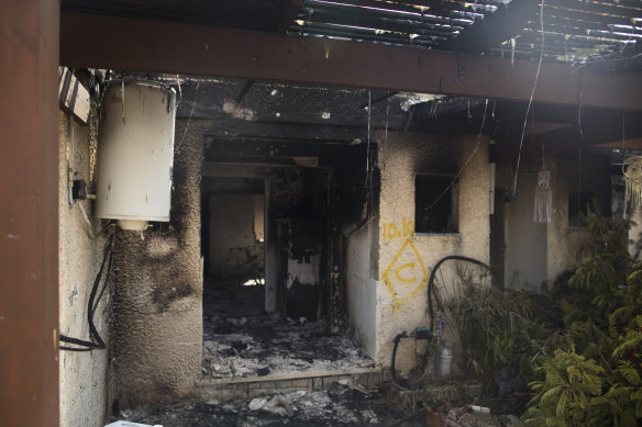 A burnt-out house after an attack by Palestinian militants on a kibbutz in Kfar Aza, Israel, near the border with Gaza. 