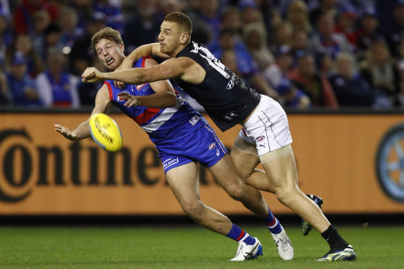 Former Blue Liam Jones spoils Mitch Hannan of the Bulldogs.