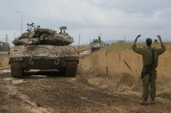 Israeli troops moved in formation near the border with Lebanon on Sunday.