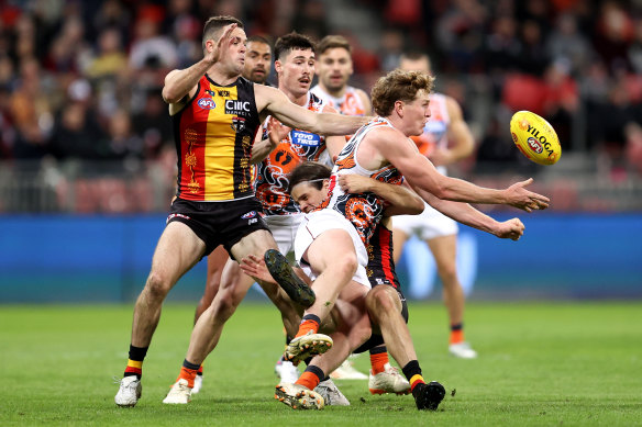 Tom Green of the Giants contests for the ball.