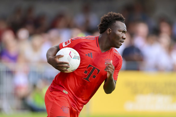 Bayern Munich’s Nestory Irakunda runs the ball back to the middle after scoring in a preseason game.