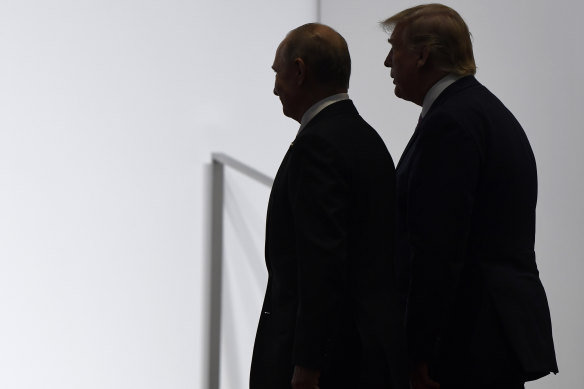 Trump and Putin walk together at the G20 summit in Osaka, Japan in 2019.