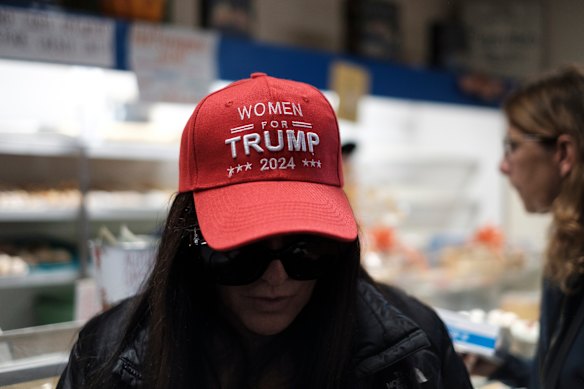 A customer wearing a “Women for Trump” hat inside Holtermann’s Bakery.