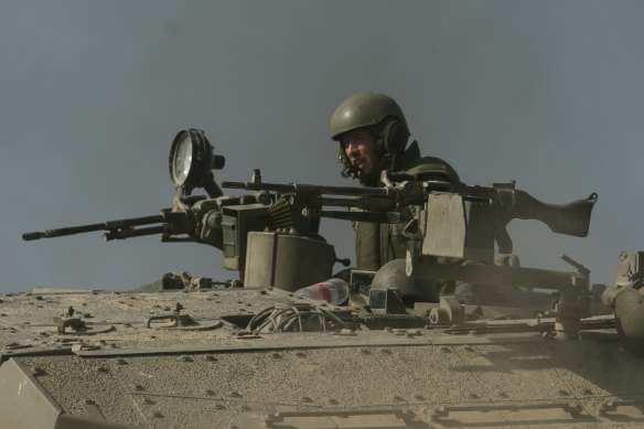 An Israeli soldier on a tank at Sderot near the Gaza border.