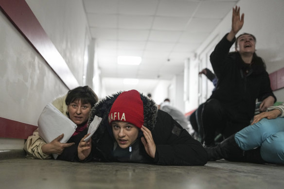 This image captured by Chernov’s colleague Evgeniy Maloletka shows  residents of Mariupol cowering in a hospital corridor during a missile attack. 