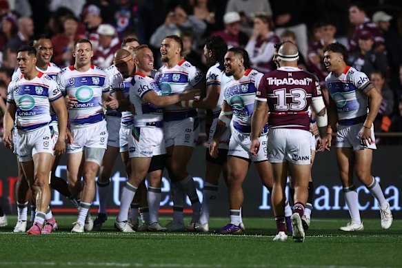 The Warriors celebrate James Fisher-Harris’ try after nine seconds.