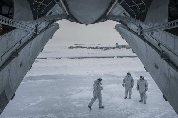 Russian soldiers near a cargo plane at the Trefoil Base on Franz Josef Land, Russia’s northernmost military outpost.