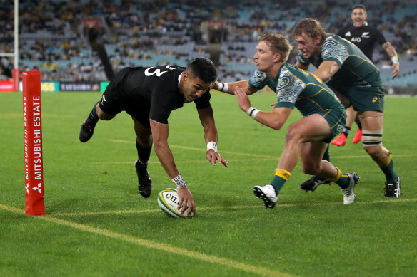 Rieko Ioane of the All Blacks scores a try.