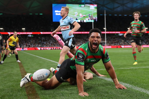 Souths winger Taane Milne crosses for a first-half try on Saturday night.