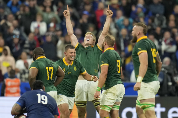 South African players celebrate as they defeat France.