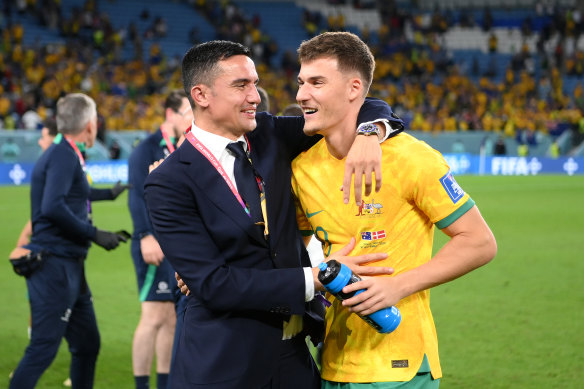 Tim Cahill congratulates Ajdin Hrustic after the historic win over Denmark last week.