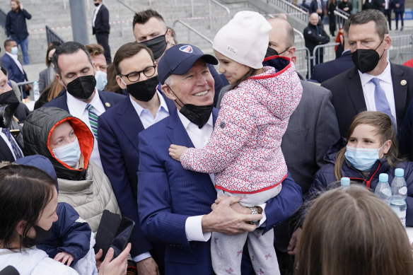 President Joe Biden meets with Ukrainian refugees during a visit to PGE Narodowy Stadium in Poland.