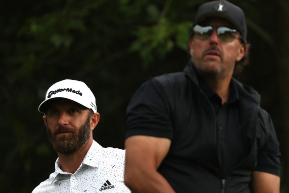 Dustin Johnson and Phil Mickelson on Thursday.