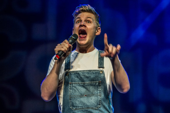 Joel Creasey on stage at last year's Canberra comedy gala.