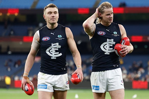 Tom De Koning (right), pictured here with Blues skipper Patrick Cripps after their win over Essendon, is expected to leave for St Kilda in the off-season.