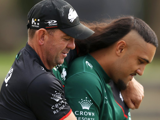 Keaon Koloamatangi is embraced by coach Jason Demetriou at Souths training this week