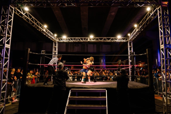 A huge crowd packed around the ring during the Sukeban match in Miami.