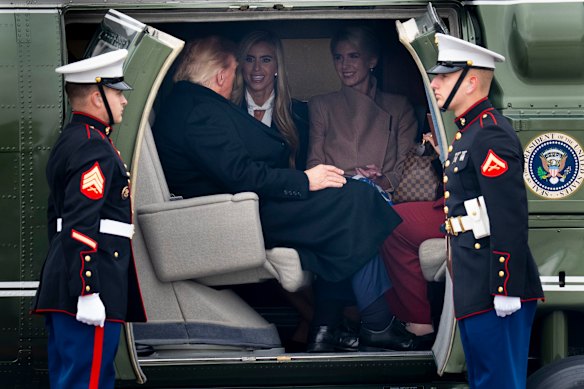 Former White House Press Secretary Katie Zacharia and Special Assistant Natalie Harp join President Donald Trump in Marine One on Tuesday.