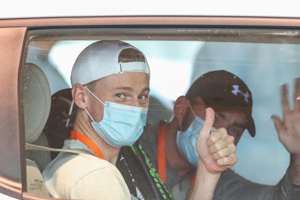 Australian tennis player Blake Mott takes a player transport van from the Grand Hyatt in Melbourne on his way to a practice session for the Australian Open.