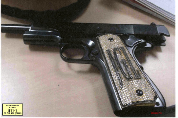 The diamond-encrusted pistol, monogrammed with his initials JGL - Joaquin Guzman Loera.