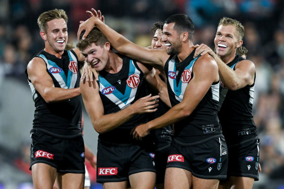 Mitch Georgiades of the Power celebrates a goal.