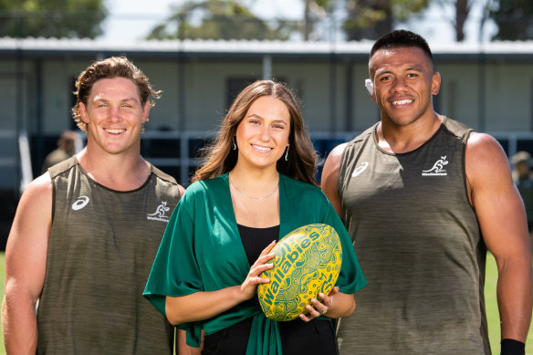 Wallabies captain Michael Hooper and prop Allan Alaalatoa with Olivia Fox, who will sing the Australian national anthem in the Eora language of the Gadigal people before the Wallabies play Argentina  on Saturday.