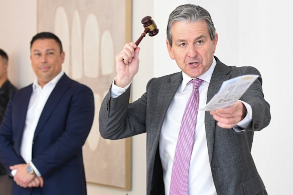 Auctioneer James Keenan raises the hammer as 30 Francis Street sells for $2.2 million, $50,000 below reserve.