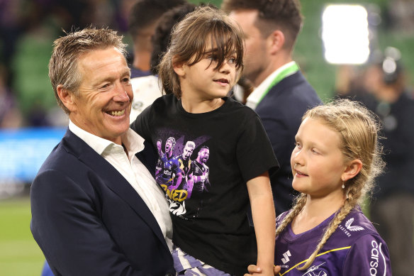 Melbourne Storm coach Craig Bellamy with granddaughter Billie (centre) in 2022.