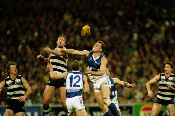 North and Geelong players jump for the ball. 