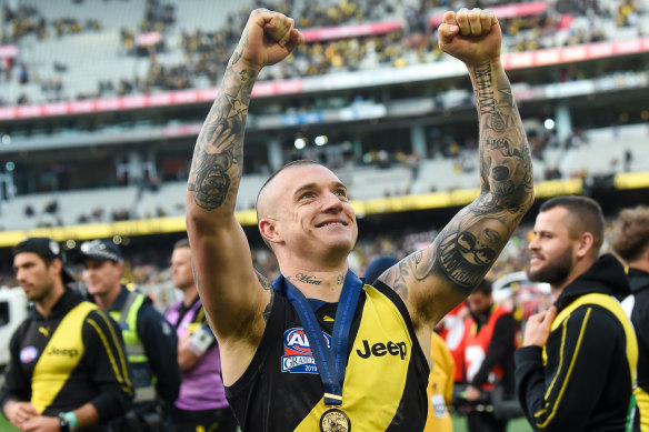 Norm Smith medallist Dustin Martin celebrates Richmond's win.