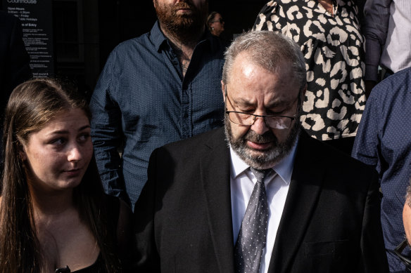 Brett Button, the driver of a charter bus that rolled and killed 10 weddings guests in the Hunter Valley, stands with head bowed as his lawyer reads an apology in Newcastle.