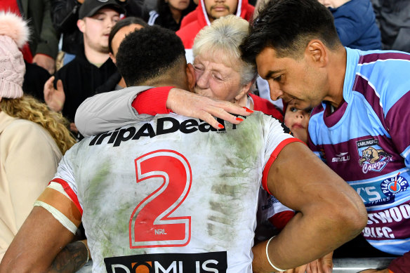 Jason Saab with his with his late grandmother, Carol, after a match for the Dragons.