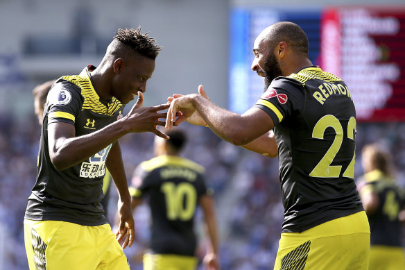 Southampton's Moussa Djenepo and Nathan Redmond celebrate Djenepo's goal.