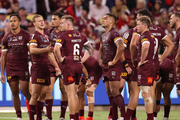 Exhausted Maroons players look on after a Blues try during game one of the 2021 State of Origin.