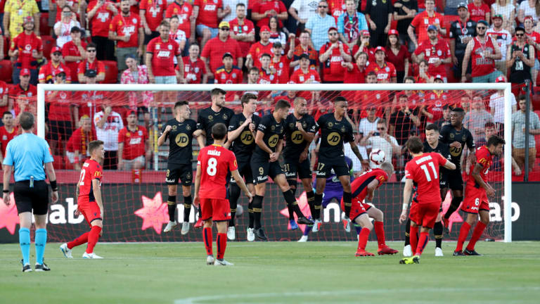 Deflection: Adelaide's Craig Goodwin was a threat from set pieces against the Wanderers.