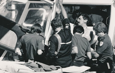 John Kapetanovski is loaded into the police helicopter.