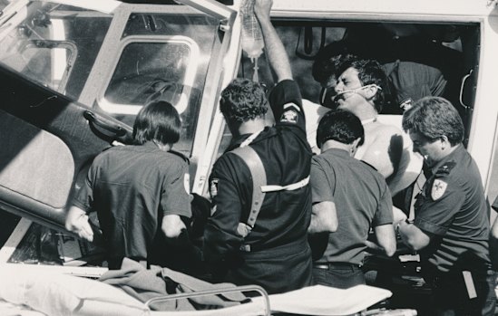 John Kapetanovski is loaded into the police helicopter.