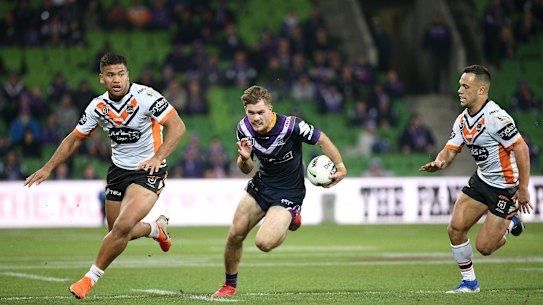 Flyin' Ryan: Melbourne's first tryscorer Ryan Papenhuyzen hits a gap.