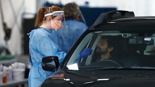 Medical staff administering COVID-19 tests in Melbourne.