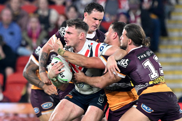 Roosters run away with victory over bruised Broncos