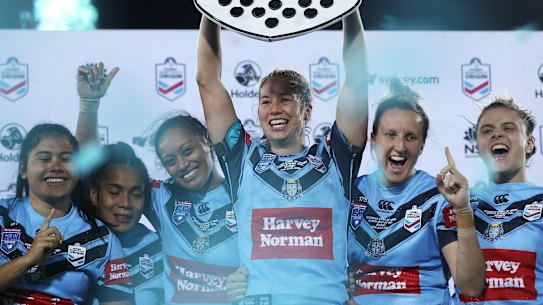 New South Wales captain Keze Apps raises the Shield after last year's Women's State of Origin.