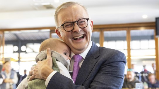 Opposition Leader Anthony Albanese holds Shadow Minister for Health and Ageing Mark Butler’s baby Charlie Butler as he meets with former Prime Minister Julia Gillard during a visit to Sfizio Cucina cafe in the seat of Sturt, in Adelaide, SA.