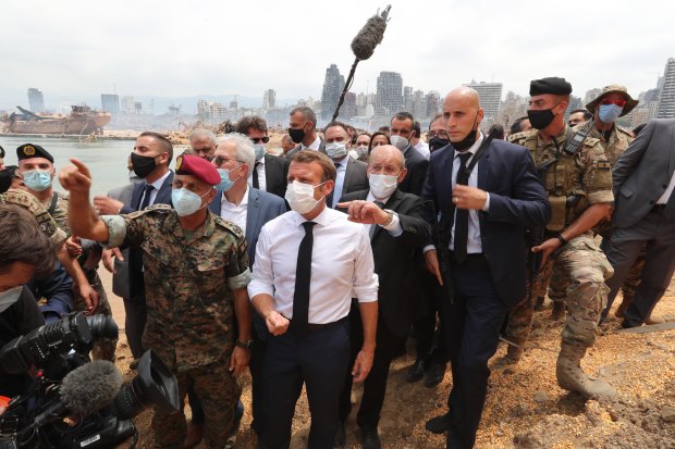 French President Emmanuel Macron inspects the site of the August 4 blast in Beirut.