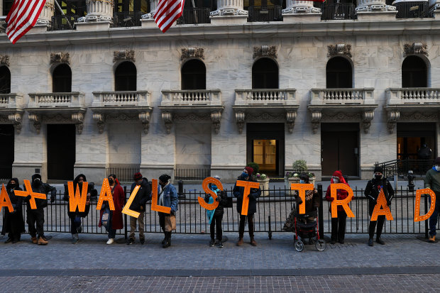 “Tax Wall Street trades”: a group of demonstrators outside the New York Stock Exchange building protest against restrictions on trading GameStop amid stock chaos in New York City on January 28. 