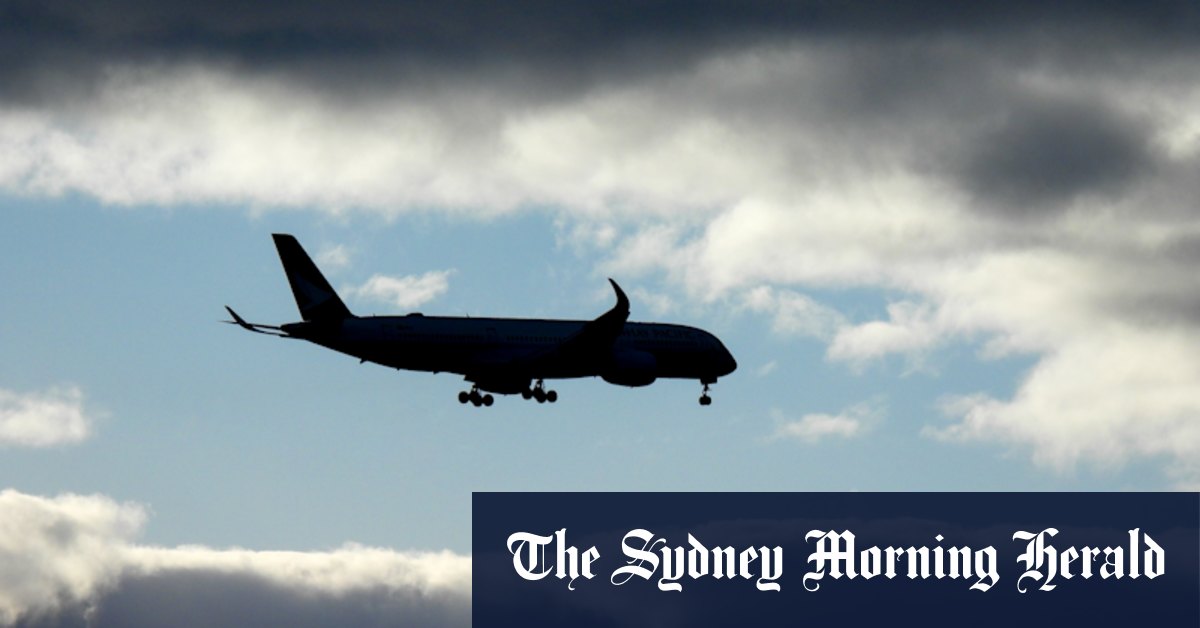 Man who tried to open plane door on flight to Sydney charged