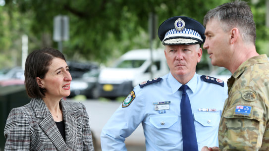 Premier Gladys Berejiklian with NSW Police Commissioner Mick Fuller and Brigadier Mick Garraway at the Victorian border checkpoint last week.
